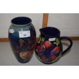 Modern Moorcroft Anemone pattern jug together with a modern Moorcroft Finches patterned vase (2)