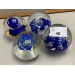 Four various assorted paperweights