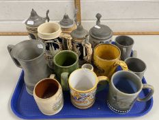 Collection of various German beer steins and other assorted tankards