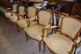 A group of five continental style armchairs, slightly differing designs, some re-upholstery