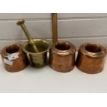 Mixed Lot: Group of three circular copper jelly moulds together with a brass pestle and mortar