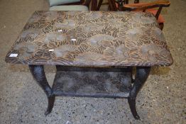 Early 20th Century Far Eastern carved soft wood two tier table with floral decoration, 85cm wide