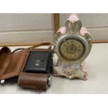 Porcelain cased mantel clock and a Kodak camera