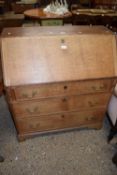 George III oak bureau with full front opening to a fitted interior over a three drawer base, 93cm