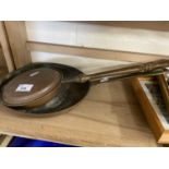 Copper frying pan and a small copper warming pan