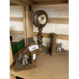 Pair of carved and metal Spaniel bookends together with a circular mantel clock on barley twist stem