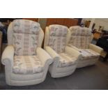 Three piece suite in cream and patterned upholstery