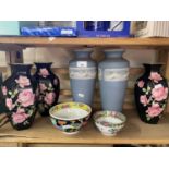 Pair of Jasper ware style vases together with a trio of black and floral decorated vases and two