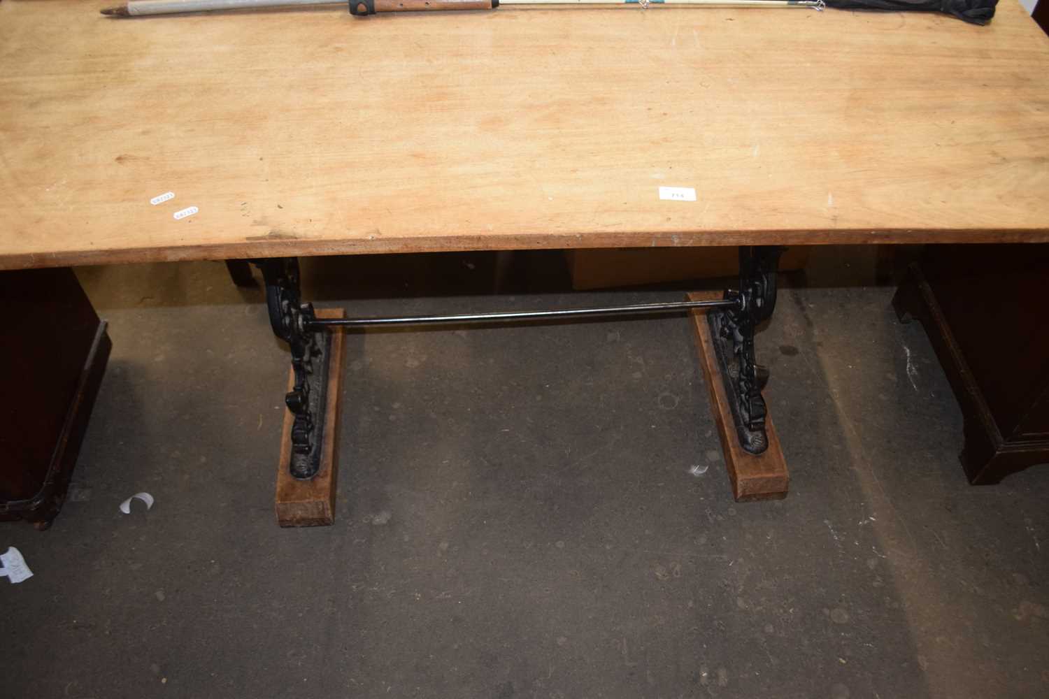 Hardwood dining table with pierced cast iron base