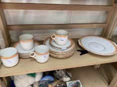 Quantity of tea wares with orange decoration and gilt trim