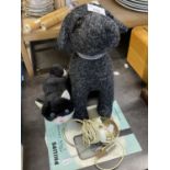 Fabric doorstop modelled as a dog together with toy cat and a tape recorder