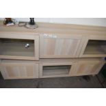 Pair of modern light wood finish lounge cabinets with glazed doors, 180cm wide