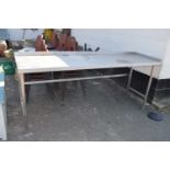 Large stainless steel kitchen preparation table