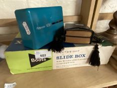 Slide box, books of Common Prayer and a slide viewer