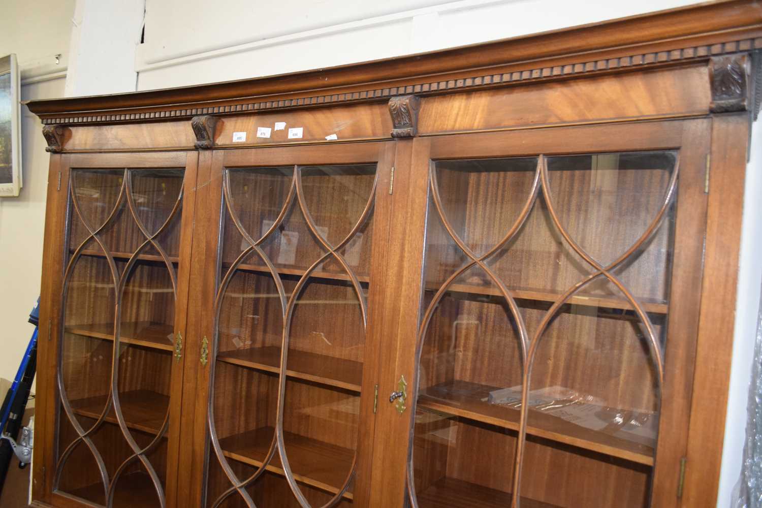 CONCAVE TRIPLE FRONT GLAZED BOOKCASE OF THREE GLAZED PANELS ABOVE AND CUPBOARDS BELOW, APPROX