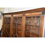 CONCAVE TRIPLE FRONT GLAZED BOOKCASE OF THREE GLAZED PANELS ABOVE AND CUPBOARDS BELOW, APPROX