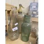 Vintage glass bottle together with a soda siphon and two decanters