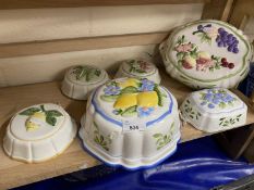 Quantity of wall mounted ceramic dishes decorated with fruits and vegetables