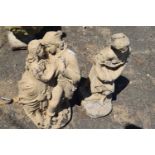 Two painted concrete garden figurines