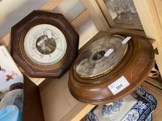 Two wooden framed wall mounted barometers