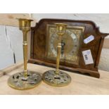Wooden mantel clock with square brass dial and a pair of dwarf brass candlesticks