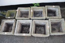 Eight various concrete plant pots