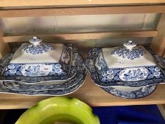 Two wooden Buddha, blue and white tureens and covers together with two serving dishes