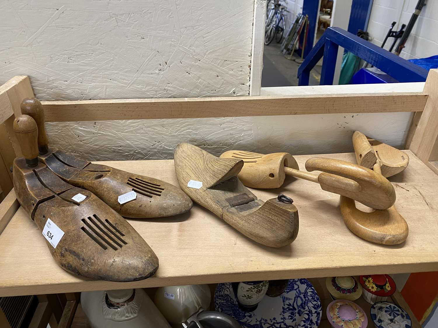 A pair of adjustable wooden shoe lasts, another similar and a pair of wooden shoe trees