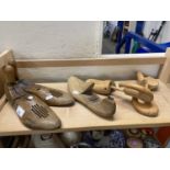 A pair of adjustable wooden shoe lasts, another similar and a pair of wooden shoe trees