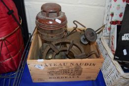 A vintage tilley lamp and gas stove