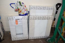 Five Stelrad compact white radiators, various sizes