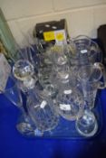 Quantity of glass ware to include champagne flutes, decanters, glass jug, shot glasses etc