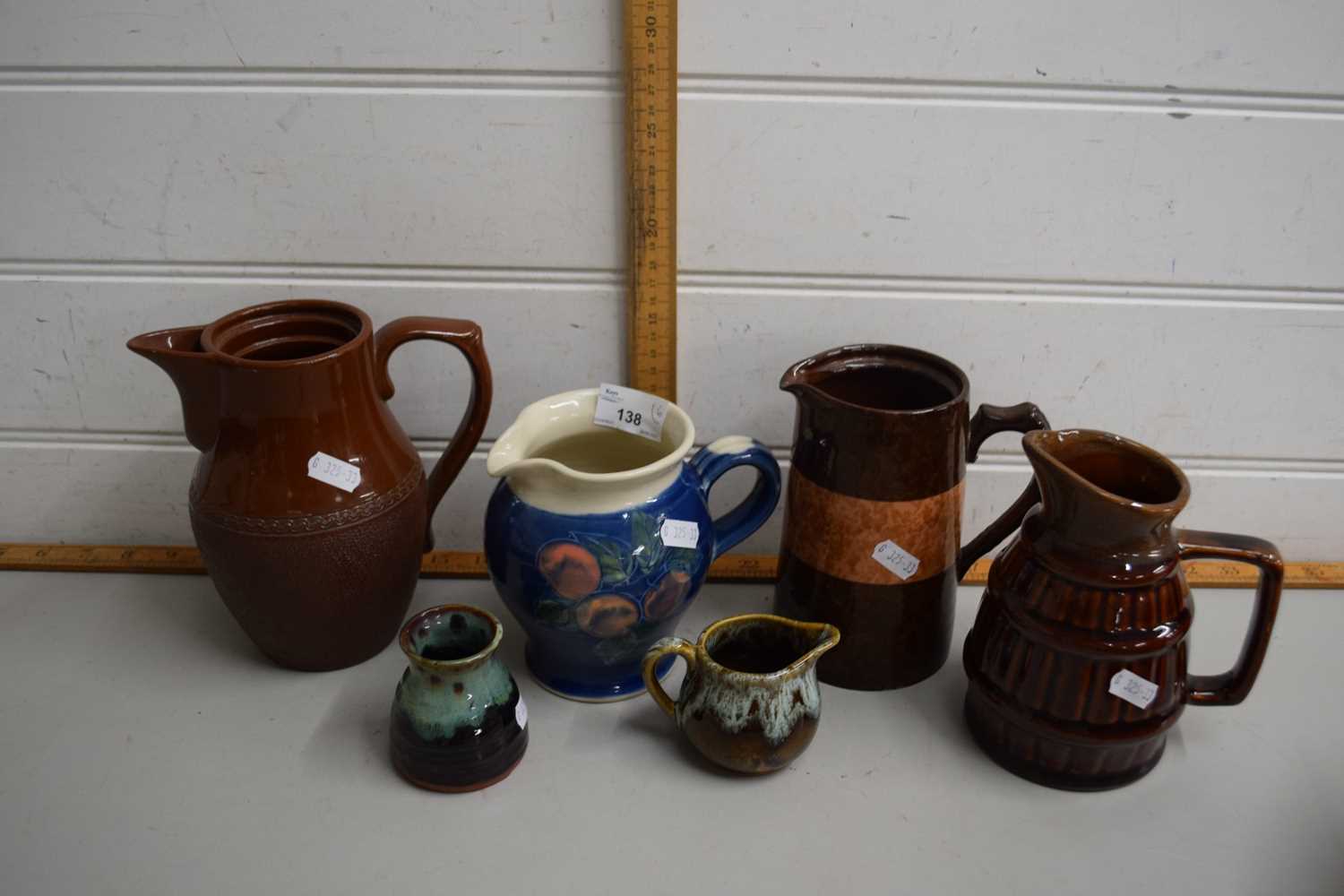 Quantity of ceramic jugs in mainly brown glaze