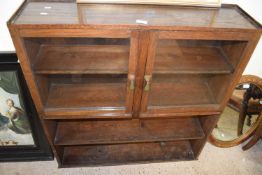 Glazed display cabinet with glazed cupboards above and two shelves below, 194cm wide