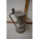 A continental pewter jug with lid