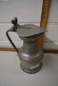 A continental pewter jug with lid