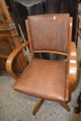 An early to mid 20th Century swivel office chair