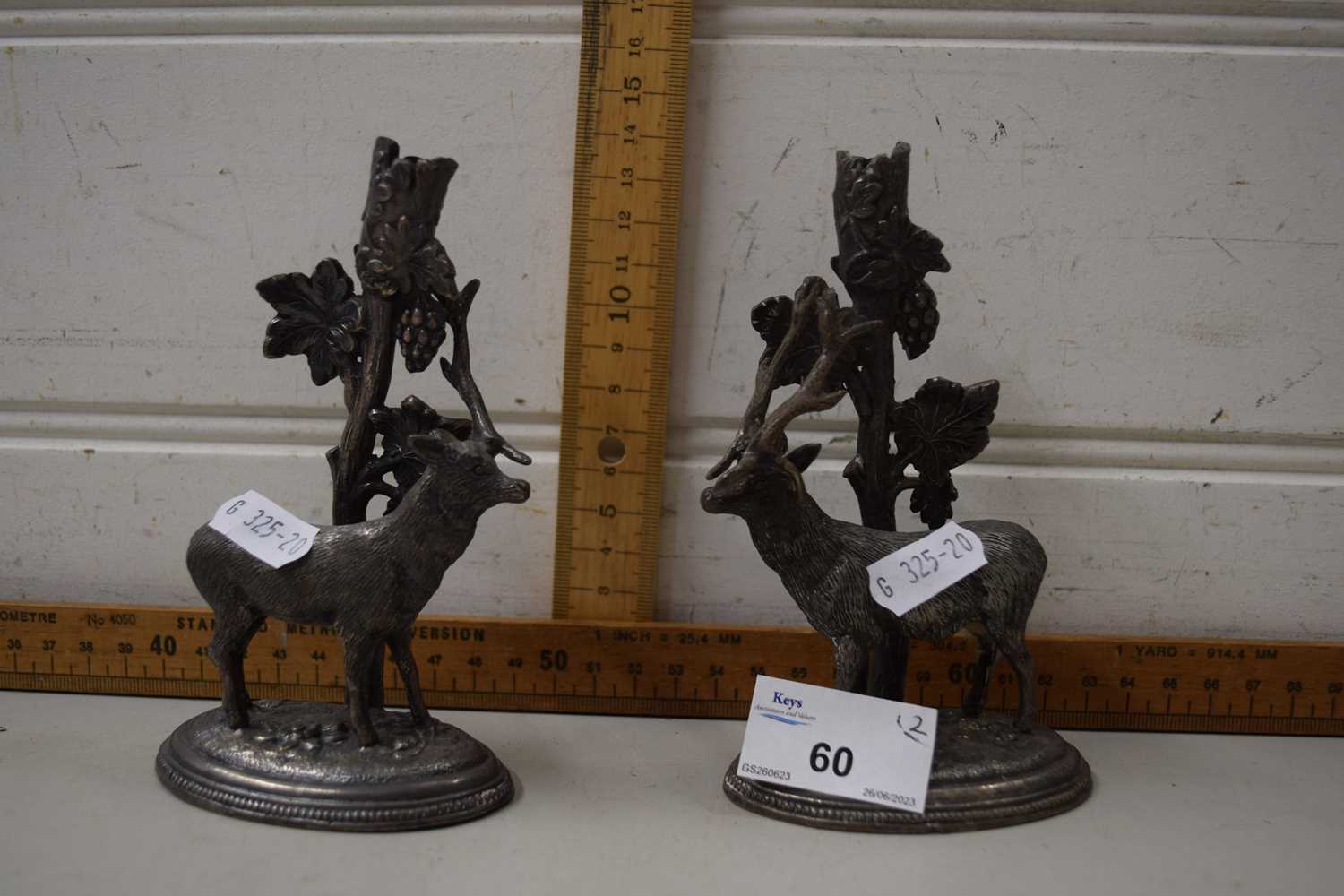 A pair of white metal stags