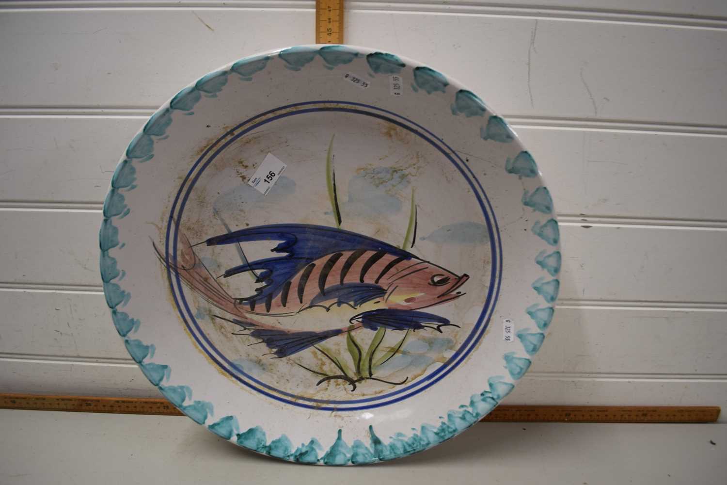Large pottery dish painted with a fish