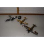 Three Dinky toy aeroplanes and a scout car