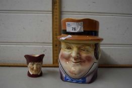 A character jug together with a small Doulton character jug