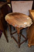 Pine side table with piecrust style top, barley twist legs united by stretchers, approx 61cm wide