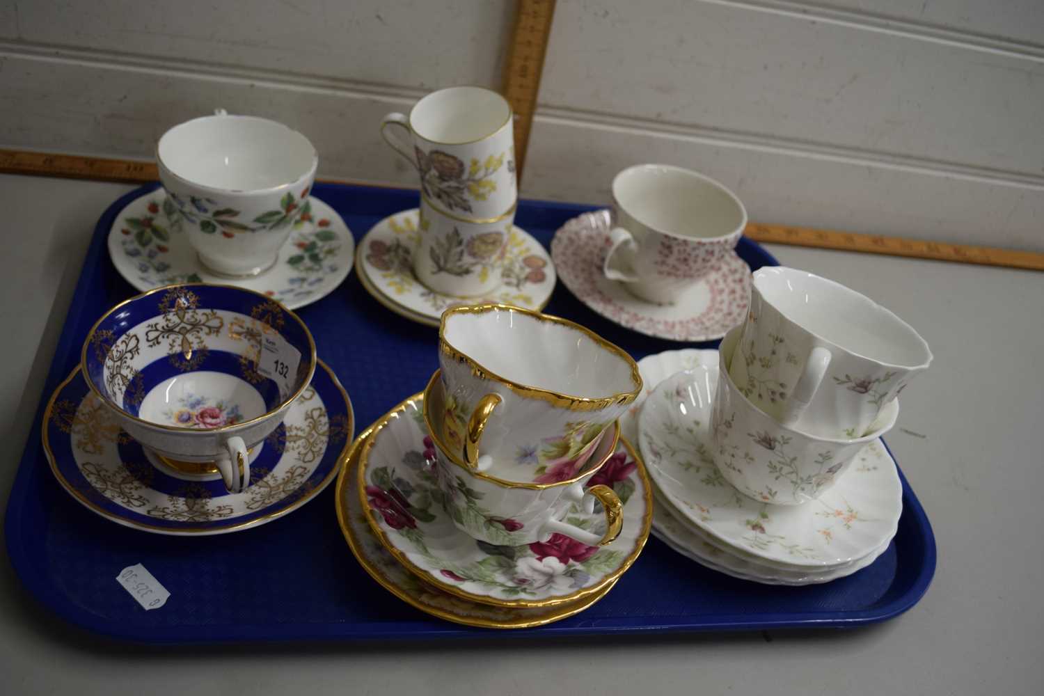 Tray containing quantity of cups and saucers by various makers including Wedgwood in the