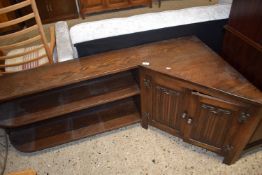 An unusual corner shelf unit with cupboard and two shelves, overall approx 153cm wide