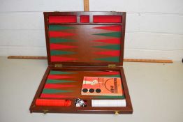 A back gammon set in wooden box