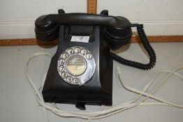 A black vintage telephone belived to be in working order