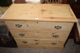 Pine chest of three long drawers with brass handles, 98cm wide