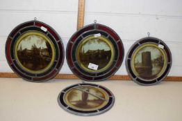 Four circular stained glass panels