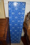 A tin plate section with blue enamel and white fleur di lis