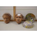 A pair of African style carved wooden heads together with a pair of decorated coconut bowls